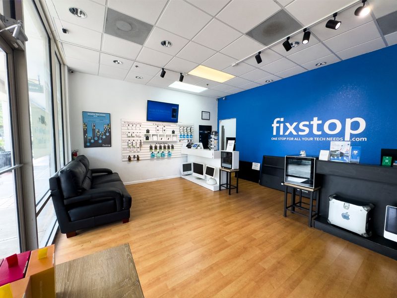 Inside FixStop electronics repair shop in Orlando, Florida: phone repair, computer repair, gaming PCs